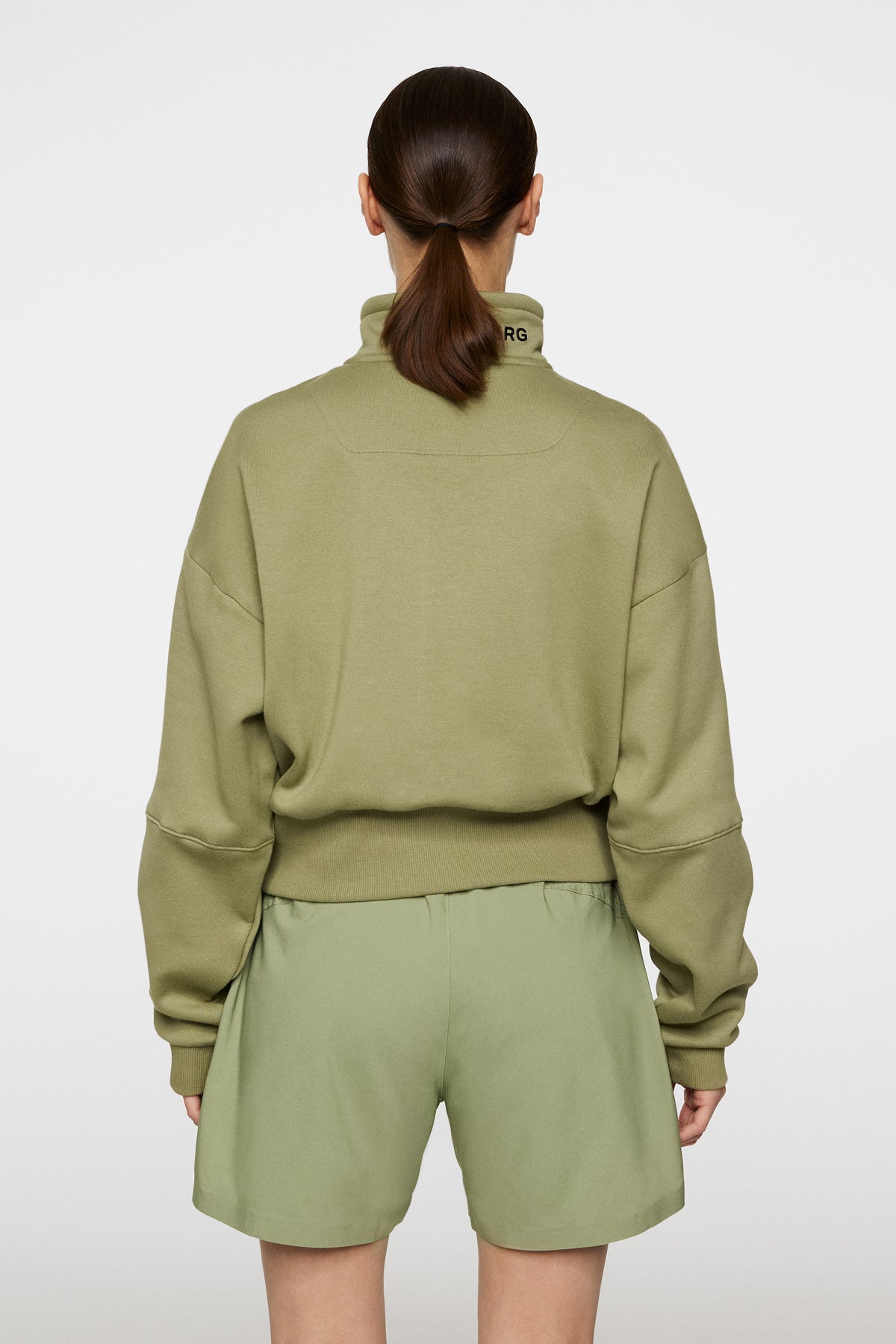 Lucia Zip Mock Neck in Oil Green by J.Lindeberg