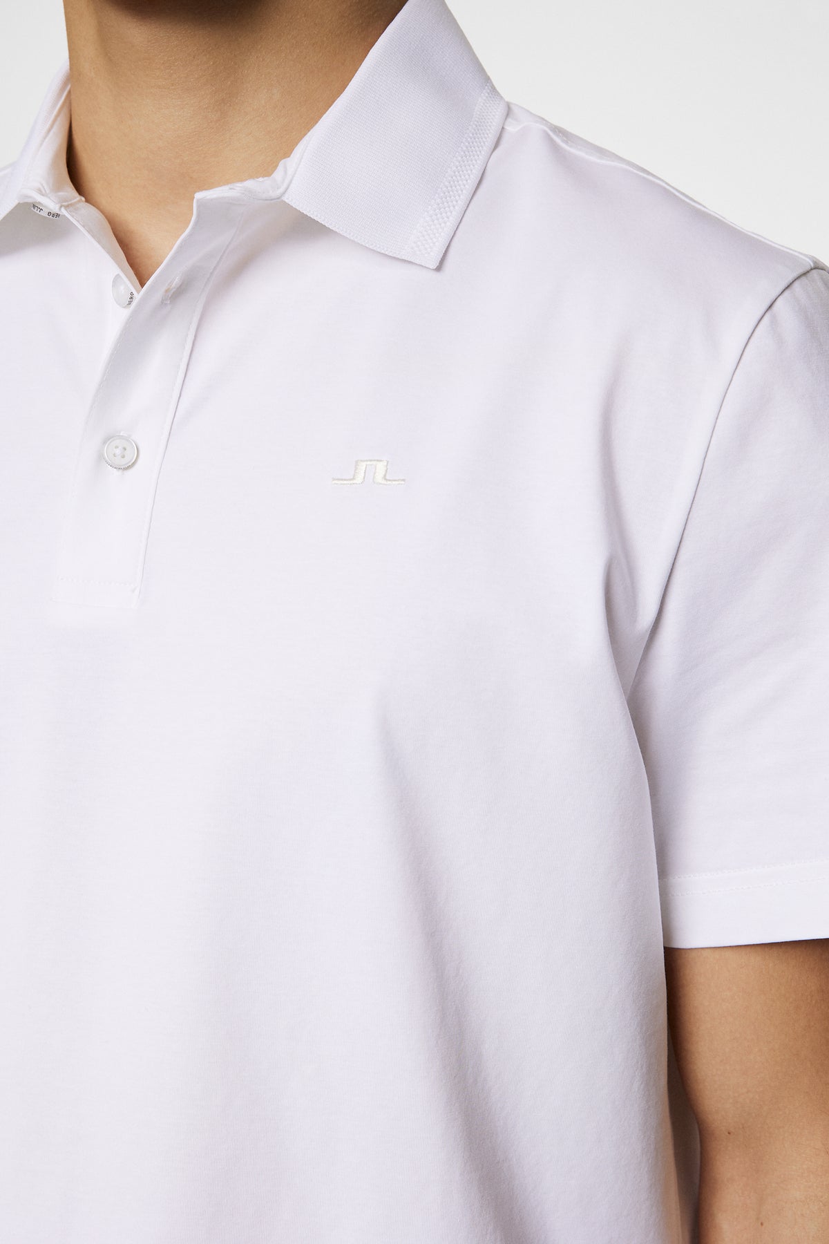 Bridger Polo in White by J.Lindeberg