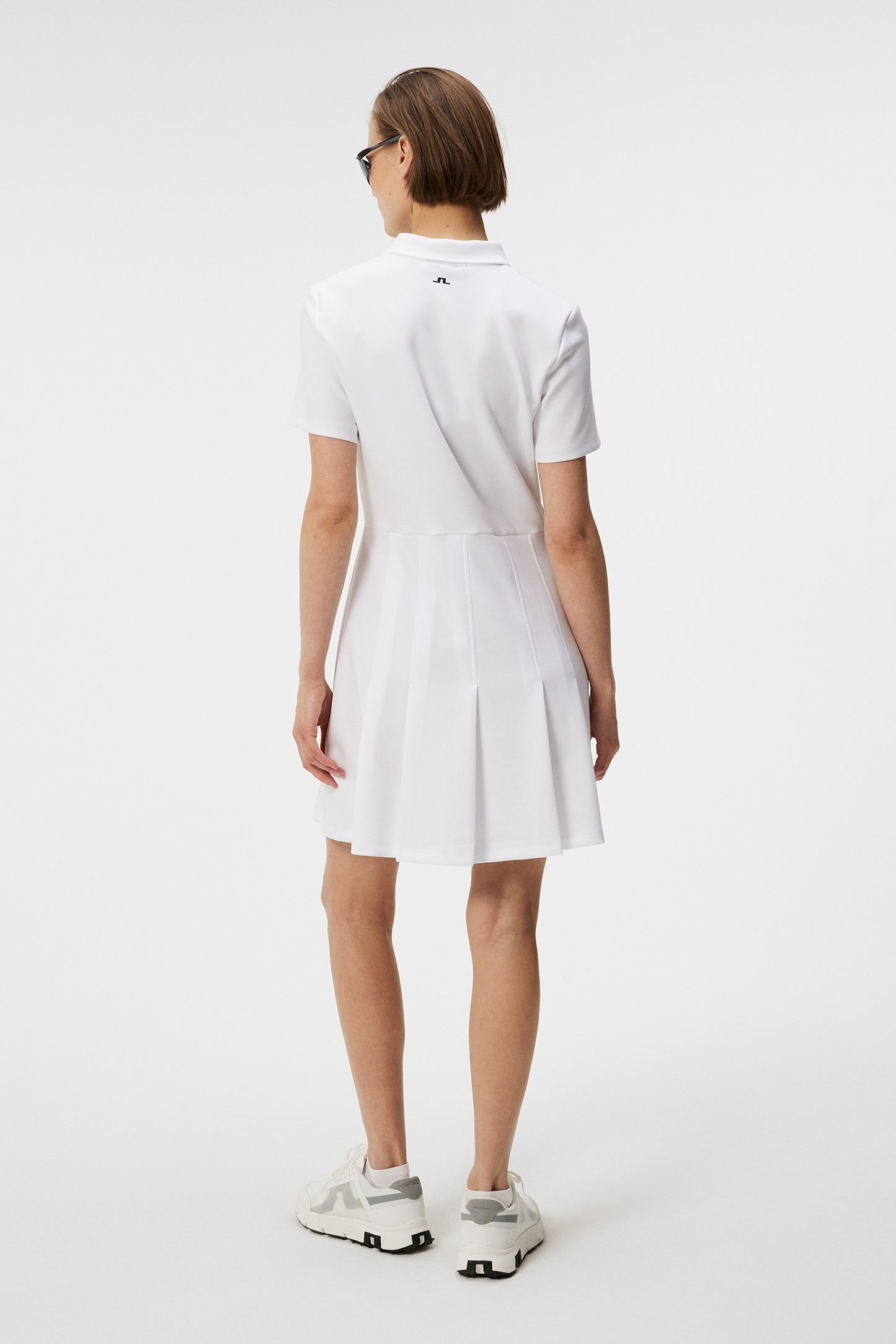 Kanai dress in White by J.Lindeberg